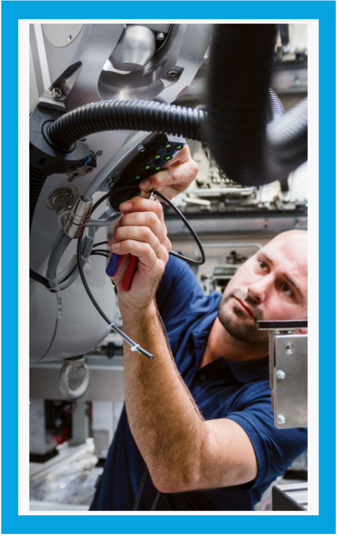Man Working on Equipment Man Working on Equipment